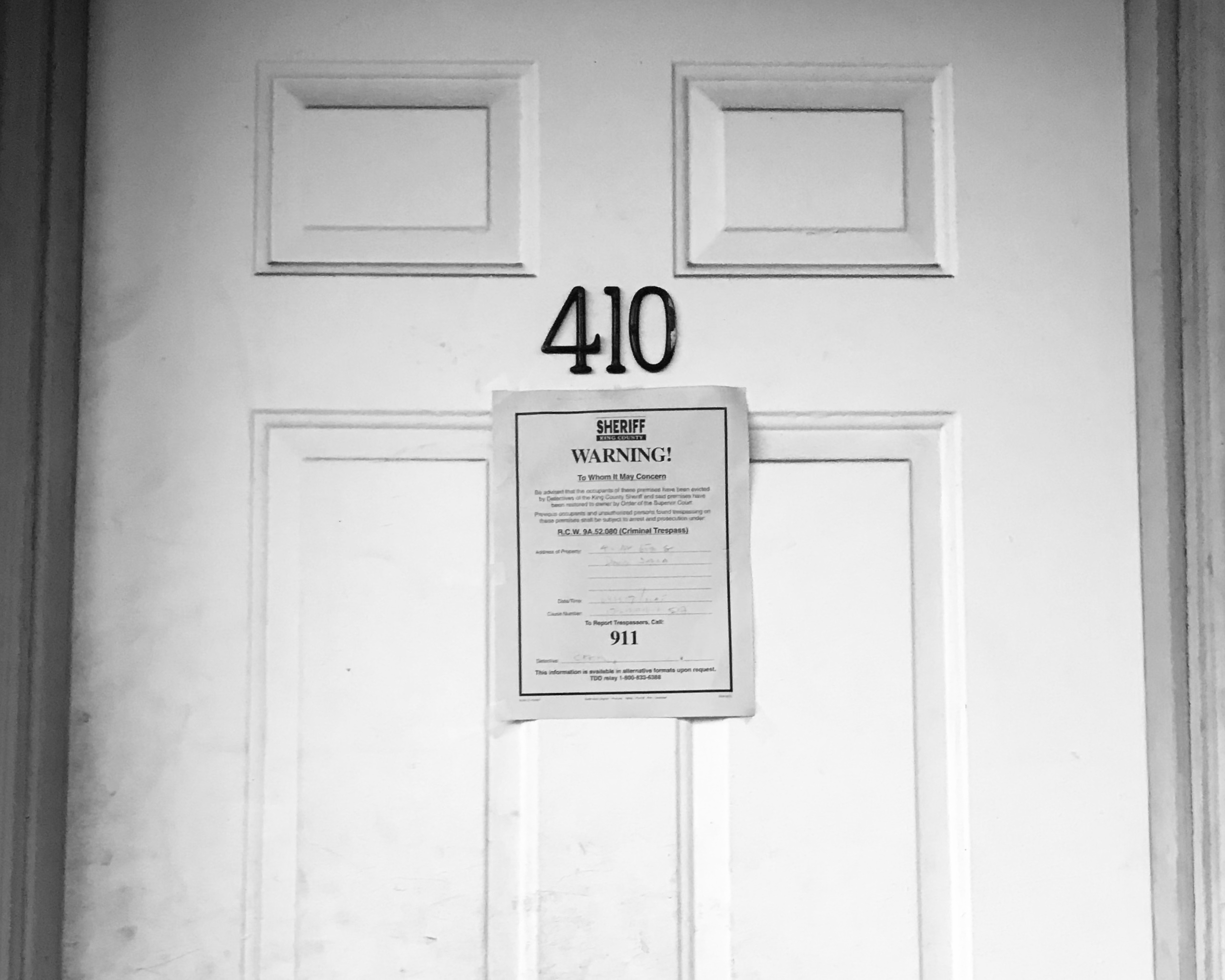 Sheriff's eviction warning posted on apartment door 410, King County